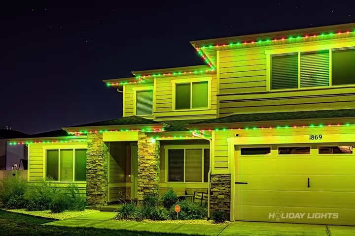 Permanent roofline lights installed along the full eaves of a New Jersey home